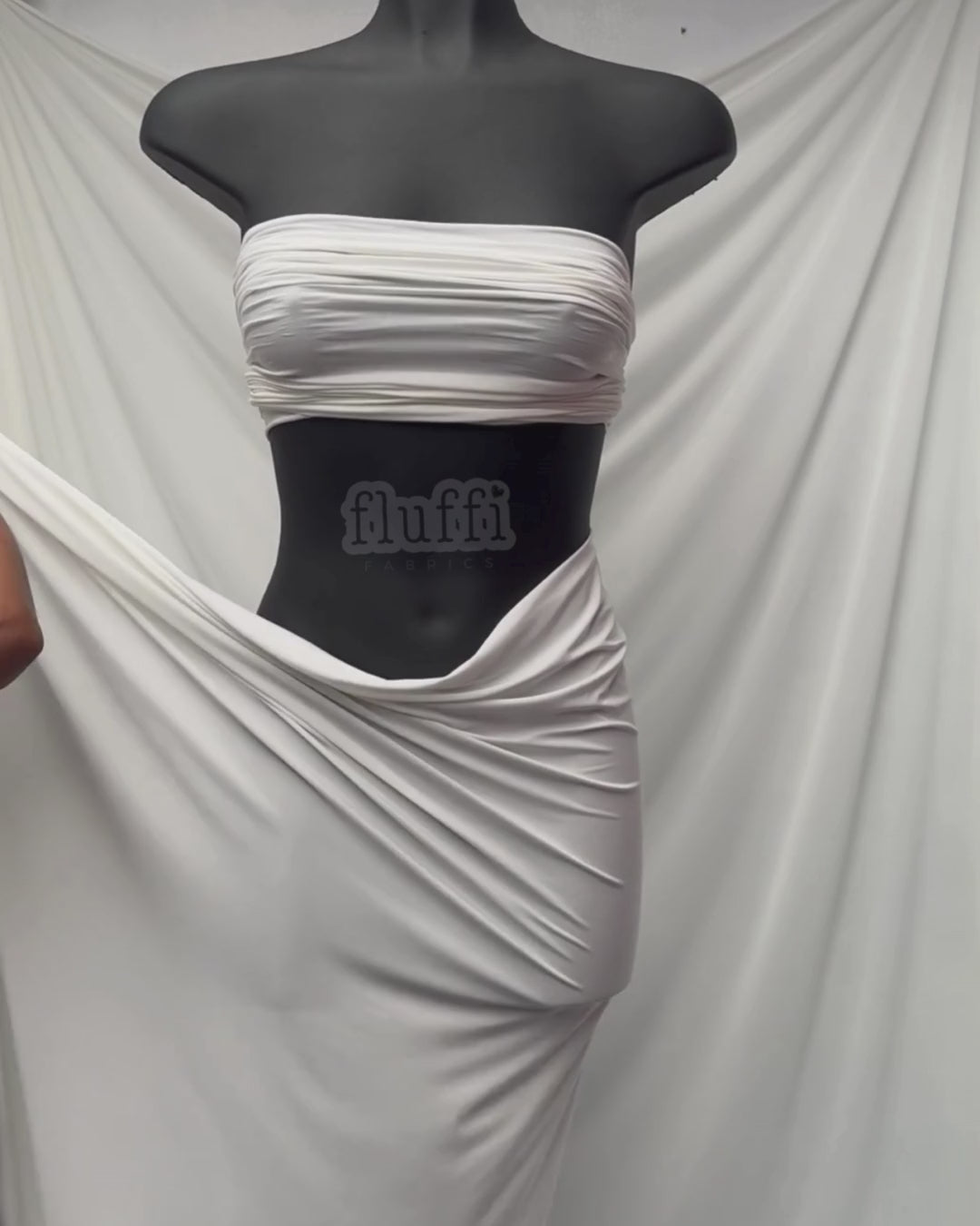 Load video: Silk Touch Jersey Stretch Dressmaking Fabric White